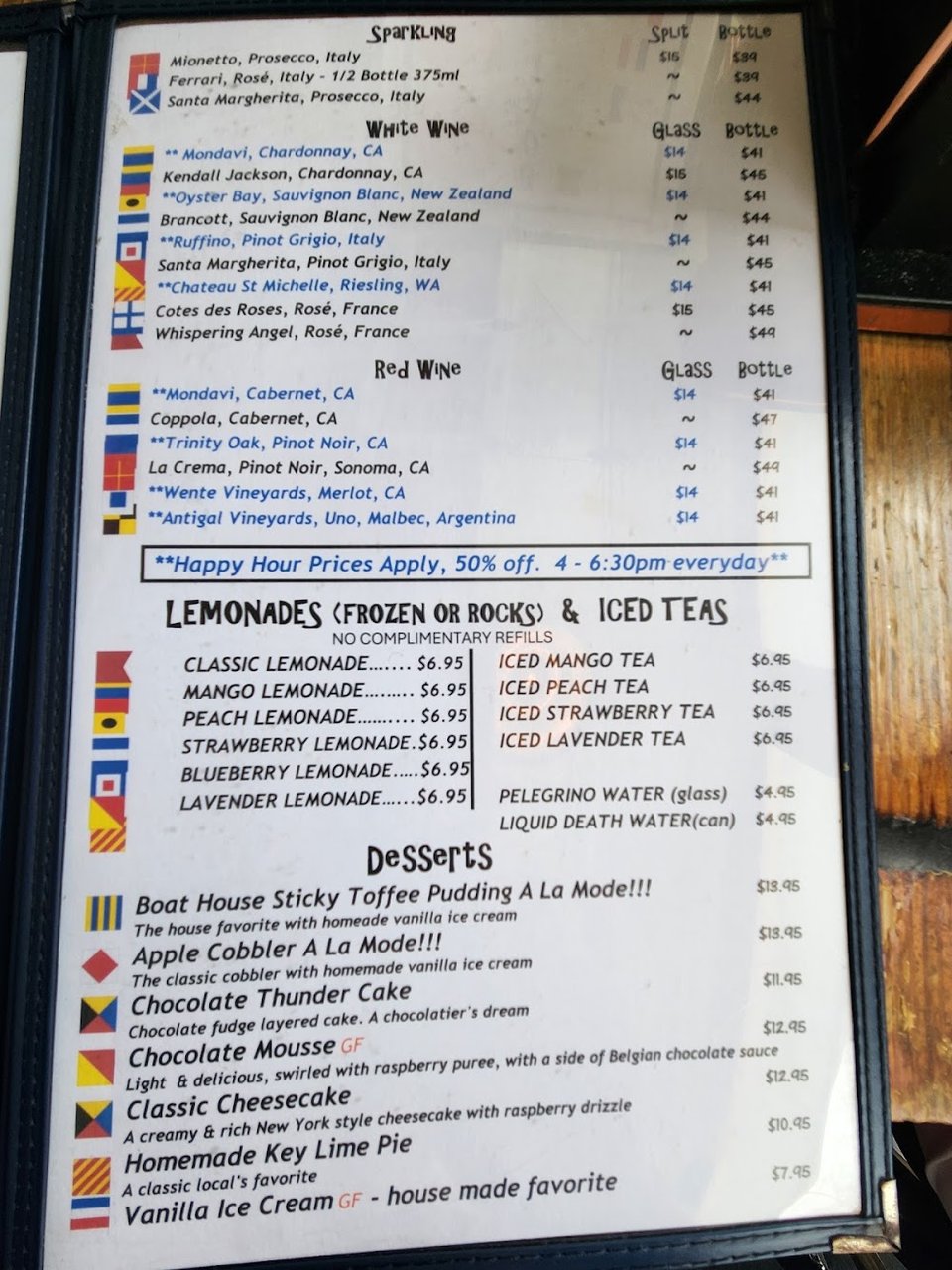 Printed menu featuring lobster, shrimp, and tuna.